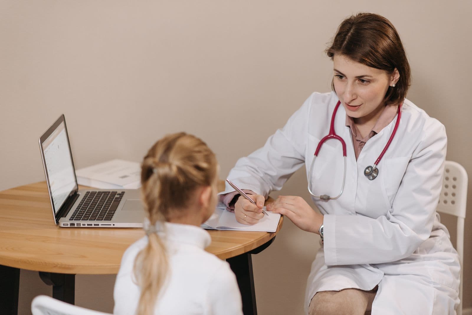 A physician consulting with a patient — every specialty billed by experts